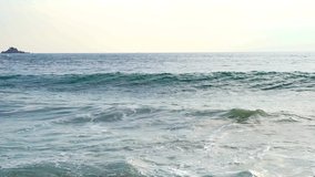 Slow motion of big ocean surfing wave. Close up video of blue, turquoise rough sea water splashing, crashing, breaking, spraying. Tropical Phuket north shore beach. Nature power, landscape background