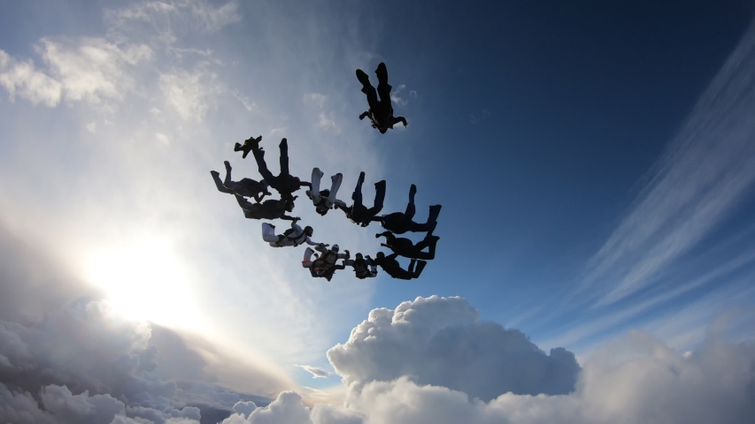 Formation skydiving in the amazing sky. Skydivers have done a circle figure. Royalty-Free Stock Footage #1032961058
