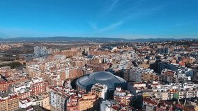 Aerial view of the city of Tarragona and the round building of the arena.