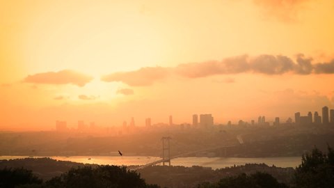 Panoramic sunset Time Lapse scene over the Bosphorus bridge and environment from Camlica Hill in Istanbul. 4K Time Lapse,Turkey. Istanbul city skyline aerial view.