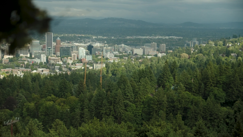 A slow motion panning shot of the view from Pittock Mansion in the hills of Portland Oregon on a cloudy day. Royalty-Free Stock Footage #1032981167