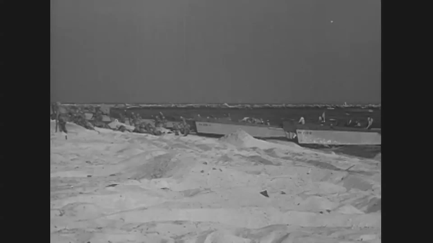 CIRCA 1943 - US Marines storm a beach.