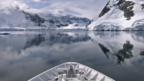 ANTARCTICA - CIRCA 2018 -Iceberg Antarctica beauty Gerlache Pass ship bow boat POV.