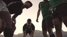 Rugby players pushing in a scrum during the rugby league. Rugby players doing a scrum at the park. - Powered by Shutterstock - Get 15% off with code: PIKWIZARD15