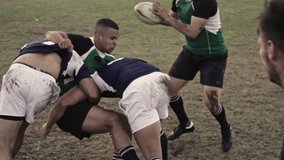 Rugby player with ball tackling the opponent during the match. Rugby players in action on the ground. - Powered by Shutterstock - Get 15% off with code: PIKWIZARD15
