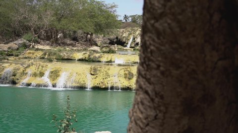 Pan of the Blue water waterfalls up in the mountains of Salalah, Oman in May.