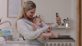 happy mother and baby having video chat using smartphone mom holding toddler enjoying sharing motherhood lifestyle on social media