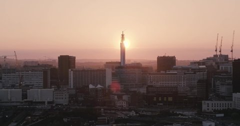 Drone footage of Birmingham, UK skyline at sunset. Captured from the south looking across the city centre.