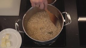 Rice and vegetables simmering in wine. Cooking risotto dish. Italian cuisine. Overhead shot