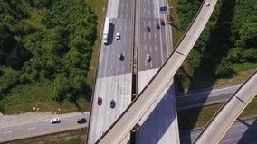 Time lapse of aerial view of traffic at major highway intersection