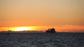 Freighter in English Bay during sunset, Vancouver, British Columbia, Canada