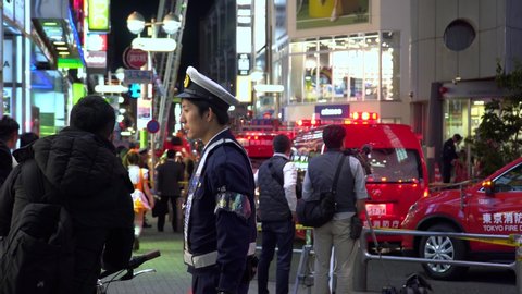 Shibuya, Japan - 10 31 2018: Japanese Emergency Services Cordoned Off City Street during Halloween in Shibuya