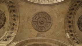 View from the bottom of the old stone ceiling with elements of architectural decorations of buildings, gypsum stucco, wall texture, plaster molding and patterns. Action. Old monument of art - Powered by Shutterstock - Get 15% off with code: PIKWIZARD15