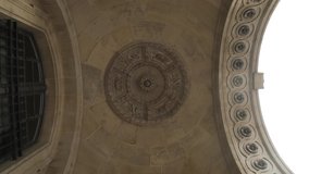 View from the bottom of the old stone ceiling with elements of architectural decorations of buildings, gypsum stucco, wall texture, plaster molding and patterns. Action. Old monument of art - Powered by Shutterstock - Get 15% off with code: PIKWIZARD15