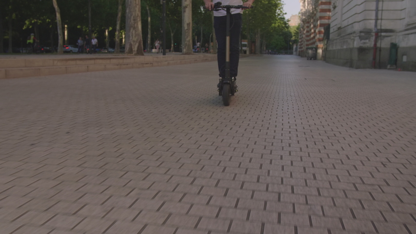 Active Man Riding on Electric Scooter in City 8