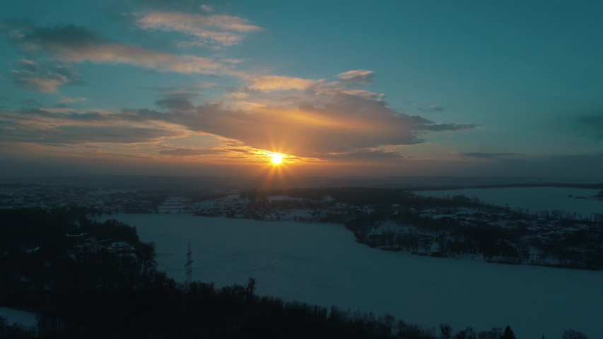 aerial view of the winter river at sunset