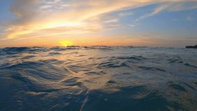 Beautiful sunset footage over the sea water surface in 4K resolution