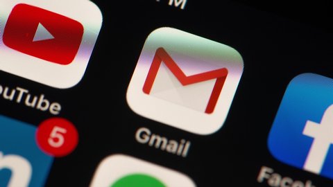 MINNEAPOLIS, MINNESOTA / USA - JULY 11, 2019: Apple i-phone closeup of Google Mail - Gmail icon alerts - going from 0-19 messages - stop motion with zoom