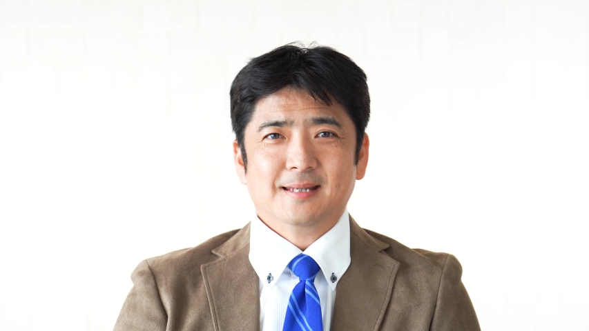 Serious Asian businessman thinking about something.