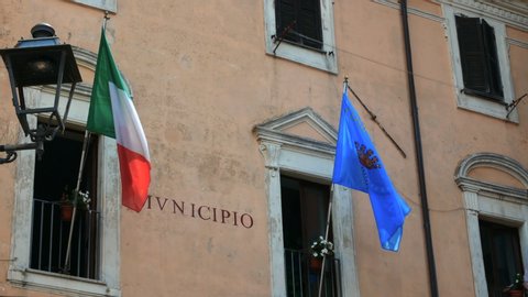 flags of Italy and Europe waving at the municipality of Nemi