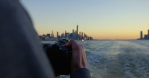 Photographing Beautiful Sunset and Beautiful Skyscrapers and Skyline In NYC On Hudson River Moving Away From Incredible New York Sunset