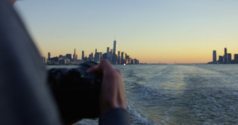 Photographing Beautiful Sunset and Beautiful Skyscrapers and Skyline In NYC On Hudson River Moving Away From Incredible New York Sunset