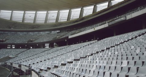 High angle view of empty spectators seat in a stadium. Spectators seats arranged in a row 4k