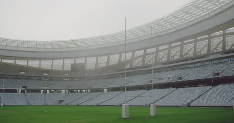 Empty rugby stadium in the morning. Rugby goal post in the ground 4k