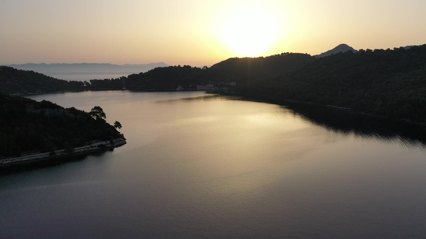 Sunrise in Croatia with mountains and water