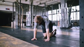 Young fitness trainer performs effective regular push-ups for burning fat in the gym. Caucasian people and sports. Explosive push ups exercise. The best exercise without equipment in the gym. - Powered by Shutterstock - Get 15% off with code: PIKWIZARD15