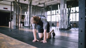 Unsuccessful attempt to push ups. Exercise for advance not for beginners. Young fitness trainer performs effective push-ups one hand for burning fat in the gym. Caucasian people and sports. - Powered by Shutterstock - Get 15% off with code: PIKWIZARD15