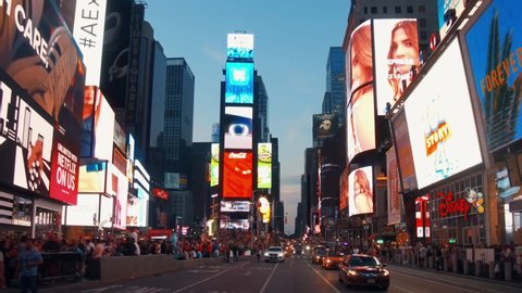 NEW YORK CITY, USA - JULY 7, 2019: Times Square night street view with LED billboards and traffic in midtown Manhattan.