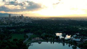Aerial Drone Timelapse - Skyline of the city of Denver Colorado at sunset, from City Park.	
