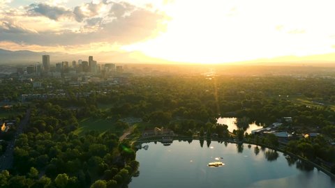 Aerial Drone Timelapse - Skyline of the city of Denver Colorado at sunset, from City Park.	
