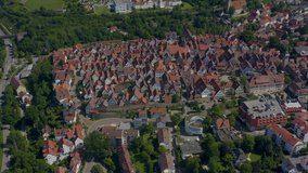 Aerial of the old part of town in Marbach am Neckar in Germany.  Very wide view with round pan to the left.