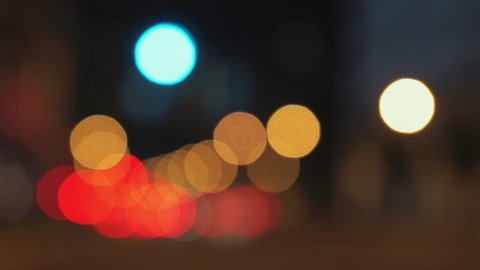 A busy city street with cars and traffic lights. The camera is  defocused to give the blurry bokeh effect. 

Could be Singapore, New York City, Los Angeles, London, Paris, Rome, Bangkok, Sydney.