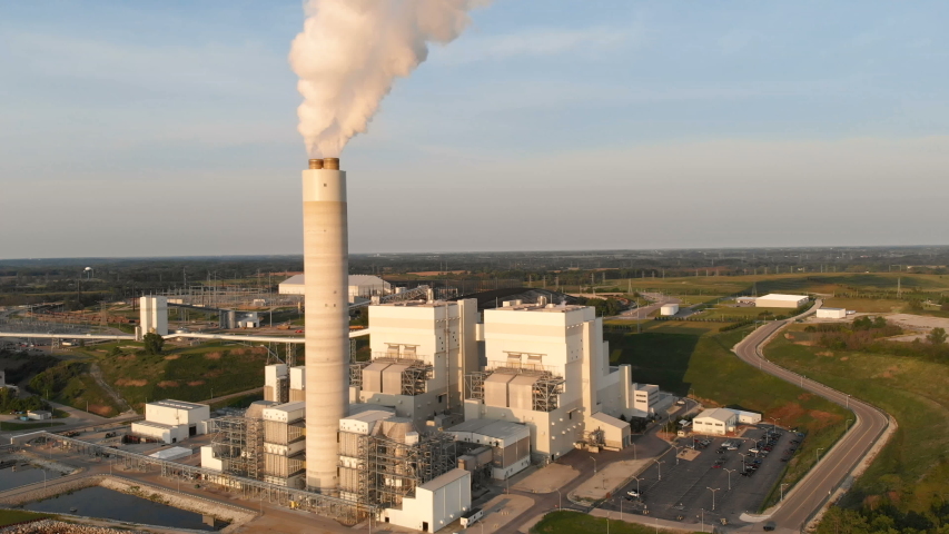 Aerial view of Power Station in Wisconsin (Milwaukee), the coast of Michigan lake at sunrise. Industrial landscape. Plant emissions, environmen pollutions 