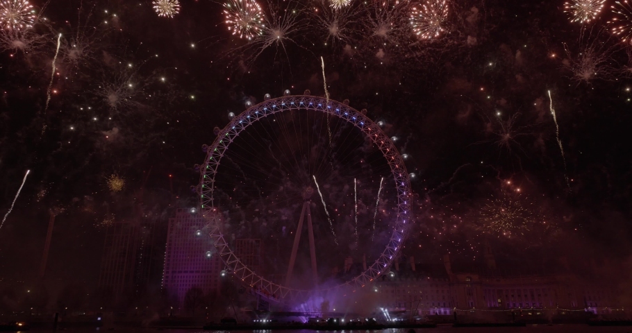 London, Outside US or Canada / United Kingdom (UK) - 01 01 2019: The Mayor of London’s New Year Fireworks Display 2018 / 2019 Fireworks light up the Thames as thousands of spectators gather to watch t