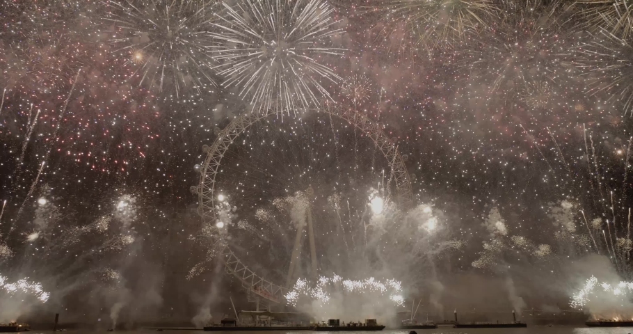 London, Outside US or Canada / United Kingdom (UK) - 01 01 2019: The Mayor of London’s New Year Fireworks Display 2018 / 2019 Fireworks light up the Thames as thousands of spectators gather to watch t