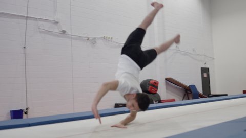 Male Trampoline Athletic Gymnast performing Stock Video