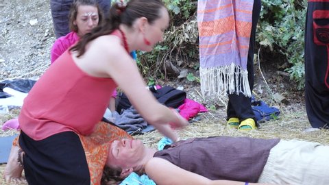 RUSSIA, ABRAU - JUNE 20, 2017: Zifa Ostashko doing Rebzo-massage. Ethno-esoteric Festival of Kwammanga, June 20, 2017 in Abrau, Russia