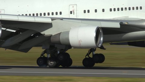 oslo airport norway - ca july 2019: huge airplane boeing 747 wheels touchdown landing extreme close up