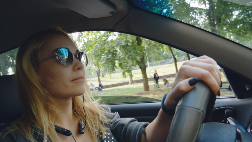 young woman driver driving a car