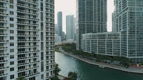 Aerial View Port of Miami and Down Town Showing Cruise Ships 
buildings Convention Centers and Arenas beaches Marinas, Rivers 
with Boats and car Traffic on a Sunny Afternoon footage in 4K slowmo