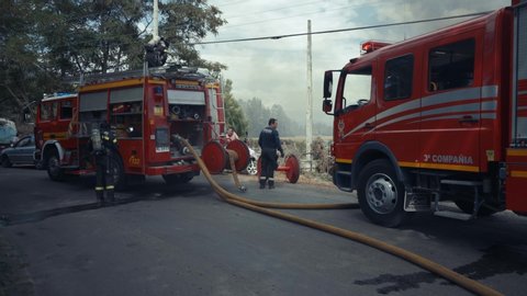 San Vicente, VI / Chile - 01 10 2019: firefighters in action on a farm in flames in Chile