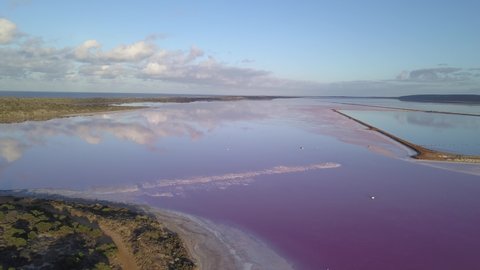Aerial view of the Pink Lake in south west Australia. The pink lake reflects the red Australian desert sun in its clear water