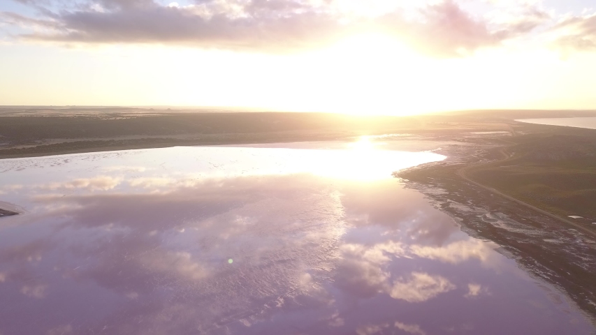 Aerial view of the Pink Lake in south west Australia. The pink lake reflects the red Australian desert sun in its clear water