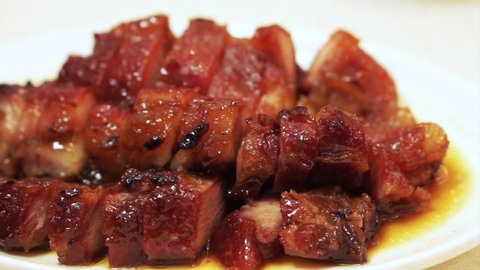 Chopsticks eating Hong Kong honey barbecue roasted pork