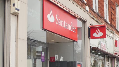 London, United Kingdom (UK) - 01 15 2019: Establishing shot of a Santander bank branch office in the London suburb of Banstead, Surrey.