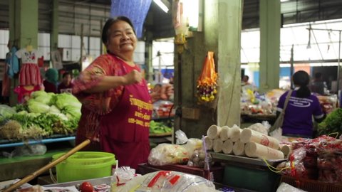 Banmai, Phitsanulok / Thailand - 12 29 2018: Market Vendor Dancing to Music in Banmai Phitsanulok Thailand